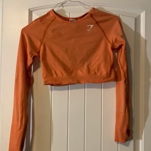 Woman’s Orange GymShark Long Sleeve Crop Top